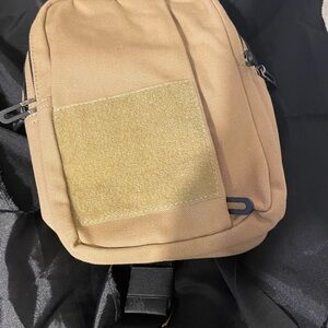 Tan crossbody concealed carry bag.